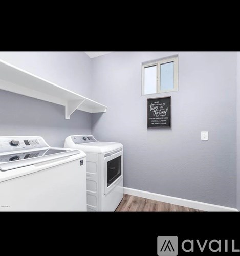 A laundry room with a washer and dryer.