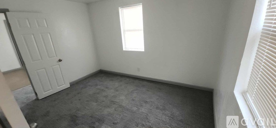 A small room with a door and a window.