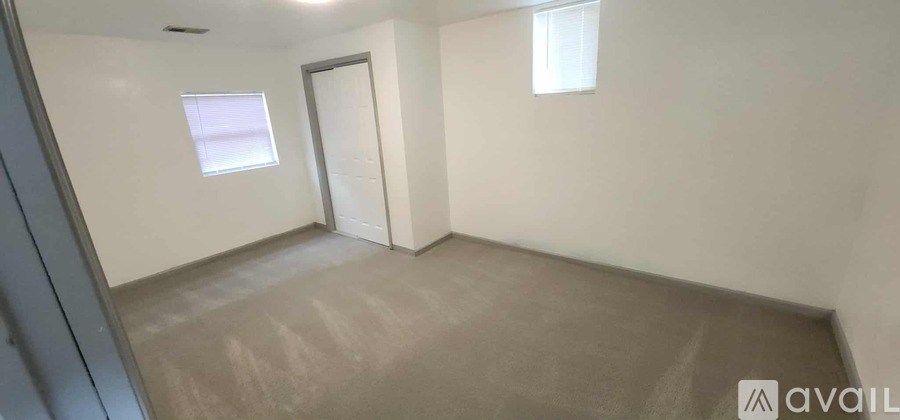 A room with a door and a window.