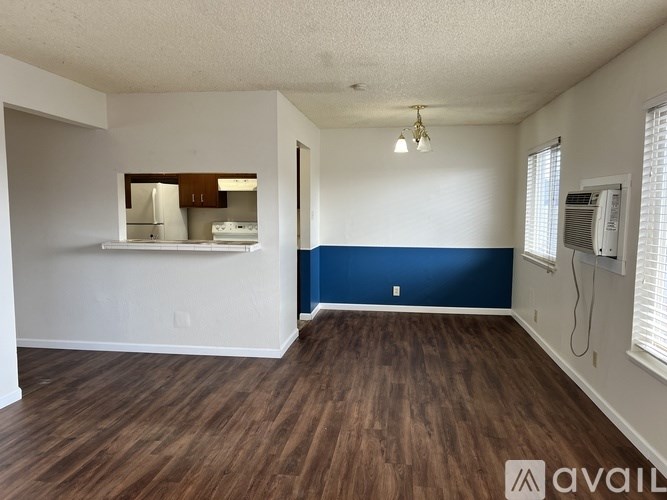 A room with wooden floors and a white ceiling.