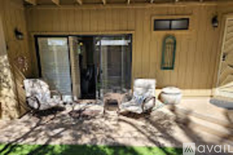 A wooden house with a glass door and a window.