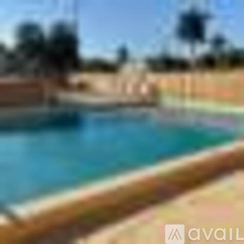 A blurry image of a beach with a pool.