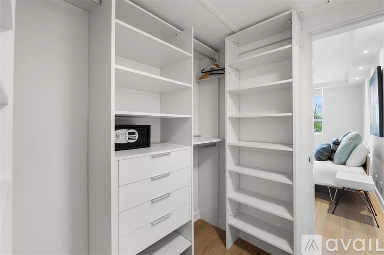 A white closet with shelves and drawers is shown.