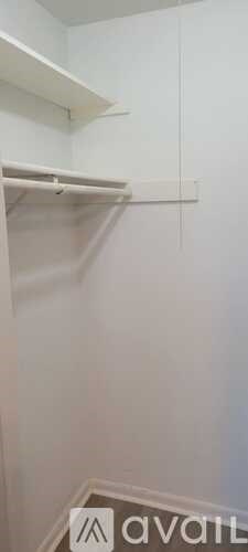 A white shelf with a sign that says "avail" on the bottom right corner.