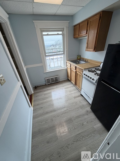 A kitchen with a window and a sink.