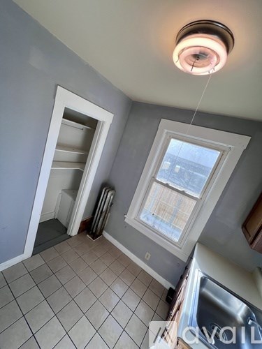 A kitchen with a window and a sink.