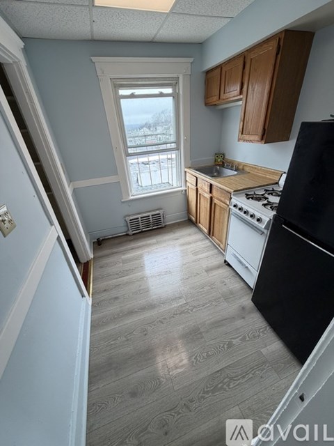 A kitchen with a window and a sink.
