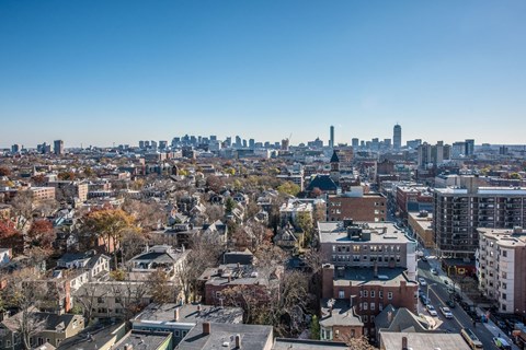 A cityscape with a mix of residential and commercial buildings.