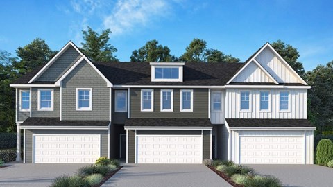 A modern two-story house with a large front yard and two garages.