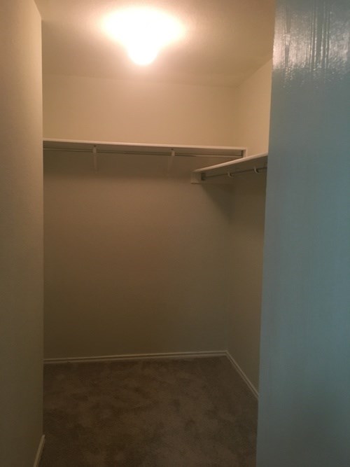 A small, empty room with a light on.