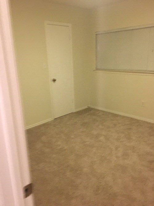 A room with a door and a window.