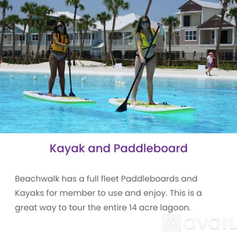 Two people paddleboarding in a pool.