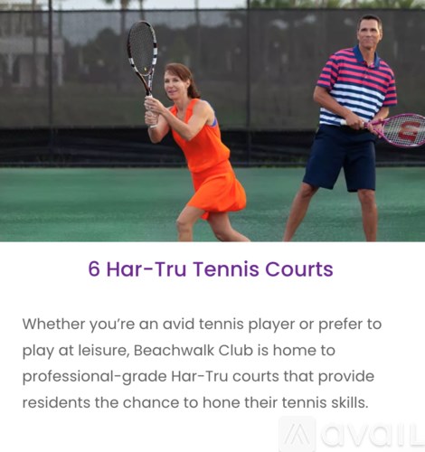 Two people playing tennis on a court.