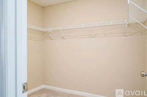 Empty room with a white metal shelf on the wall.