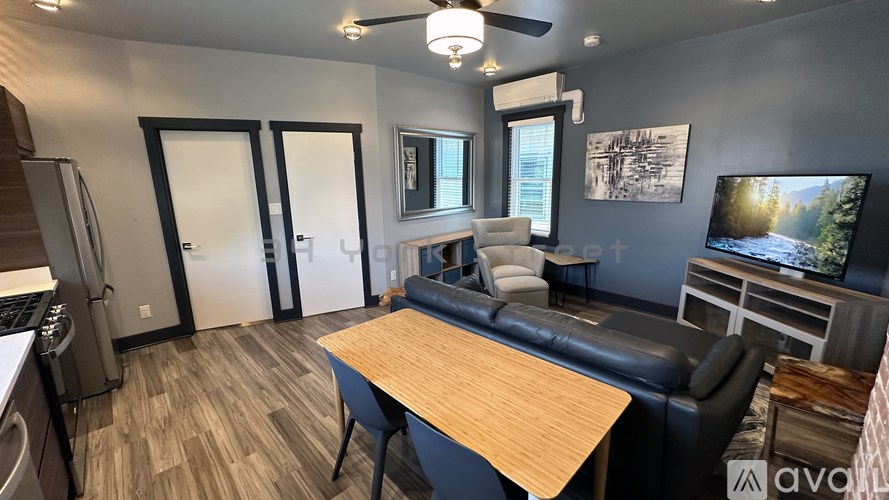 A modern kitchen with a dining table and chairs.