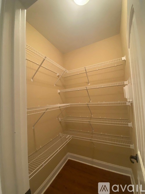 Empty white shelves in a room.
