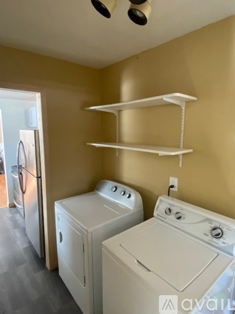 A laundry room with a washer and dryer.