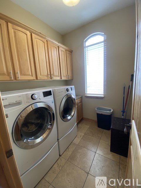 A laundry room with a washer and dryer.
