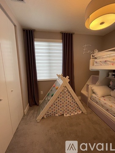 A baby's room with a crib and a play mat.