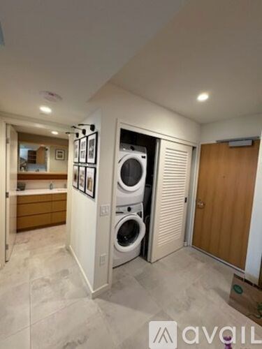 A laundry room with a washer and dryer in it.