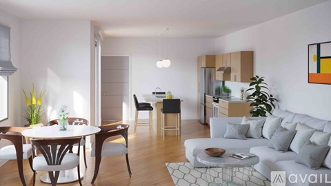 A modern living room with a dining table and chairs.