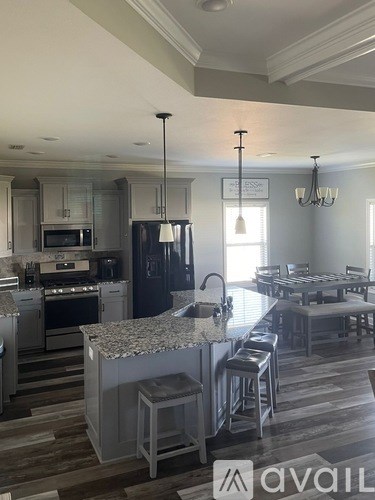 A modern kitchen with a large island in the middle.