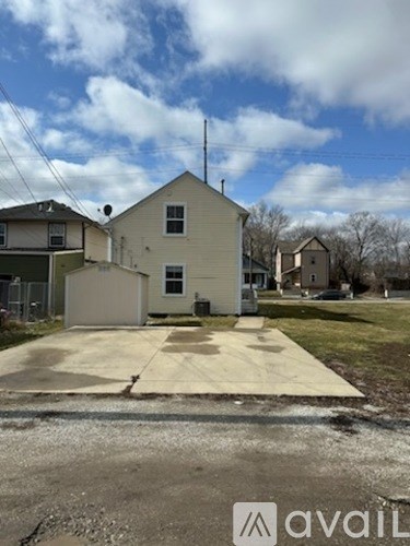 A house with a driveway in front of it.