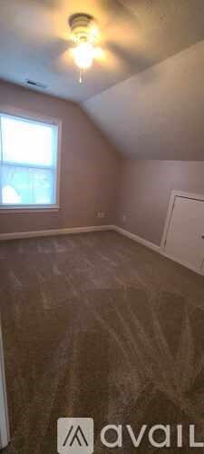 A room with a window and a door.