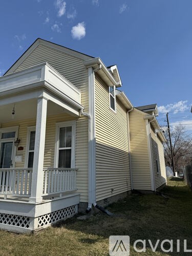 A house with a porch and a balcony is for sale.