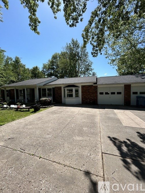 A house with a driveway in front of it.