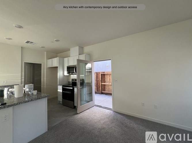 A spacious kitchen with a view of the outdoors.