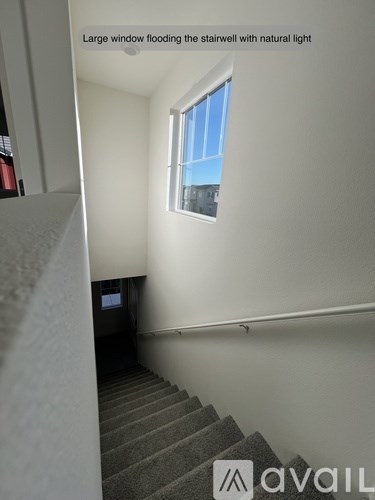 A stairwell with a window letting in natural light.