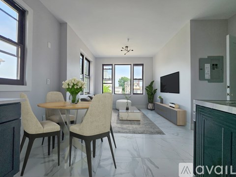 A modern living room with a dining table and chairs.