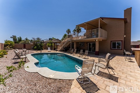 A house with a pool in the backyard.
