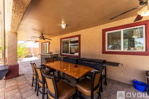 A patio with a table and chairs is shown.