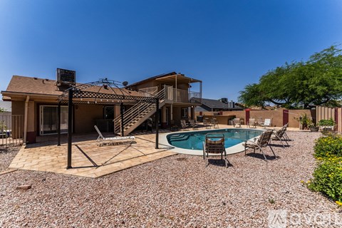 A house with a pool in the backyard.
