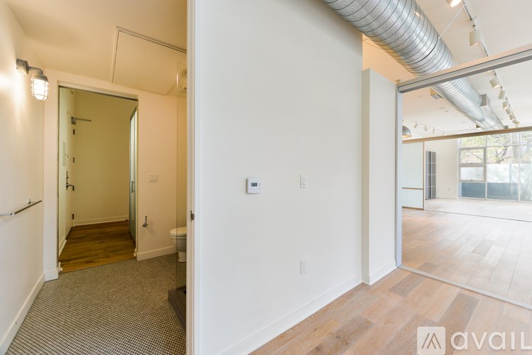 A room with a doorway leading to another room.