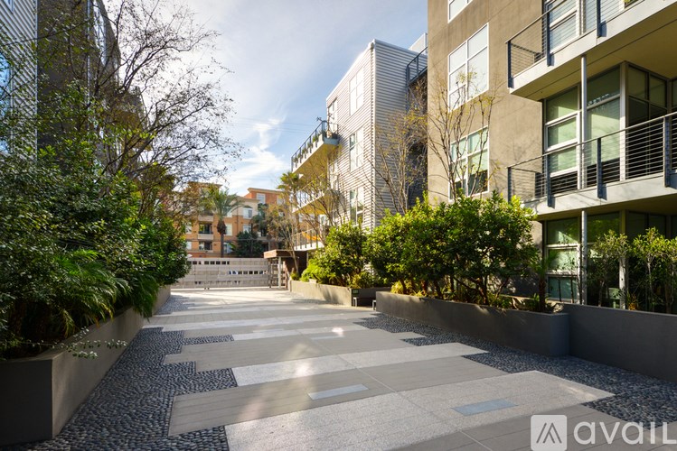 A modern building with a walkway in front of it.