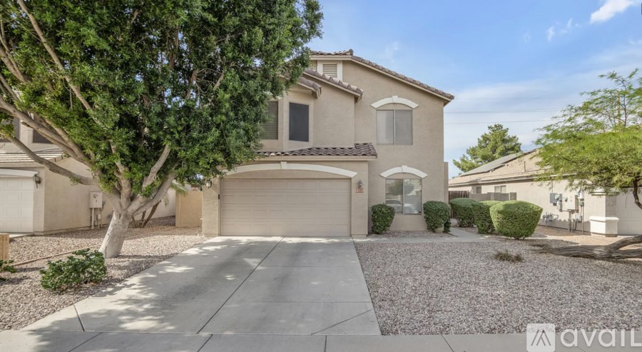 A house with a tree in front of it is for sale.