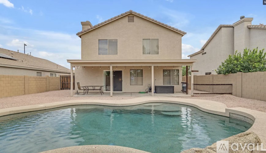 A house with a pool in the backyard.