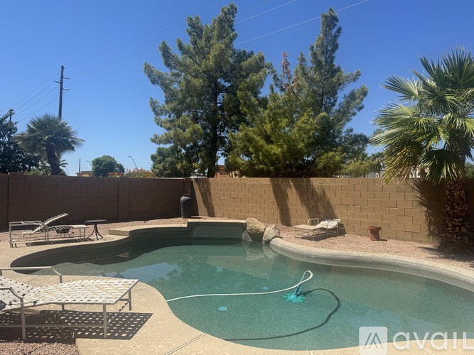A pool with a blue hose in the middle of it.
