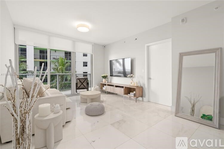 A modern living room with a white sofa set, a wooden coffee table, and a large window with a view of a building outside.