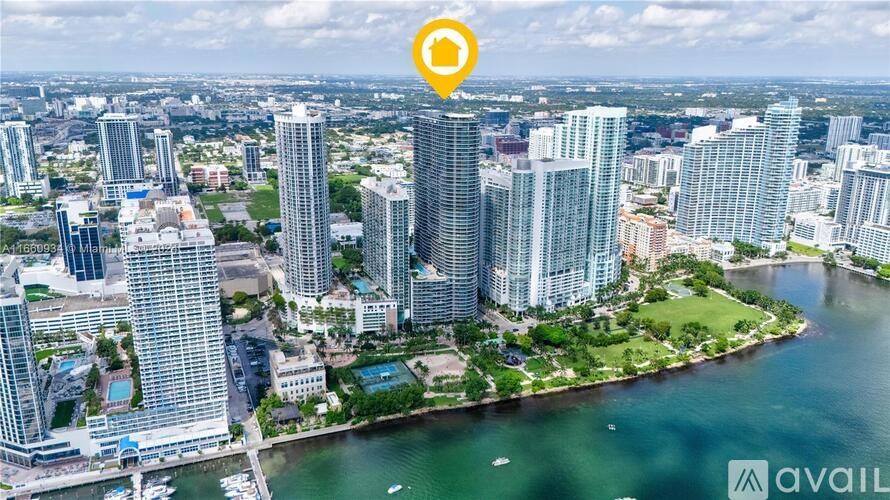 A cityscape with a waterfront and a clear sky.