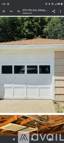 A white garage door is closed.