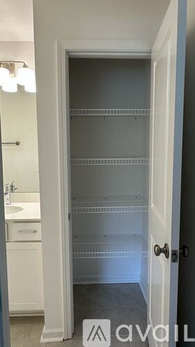 A white door with a glass panel and a black handle.