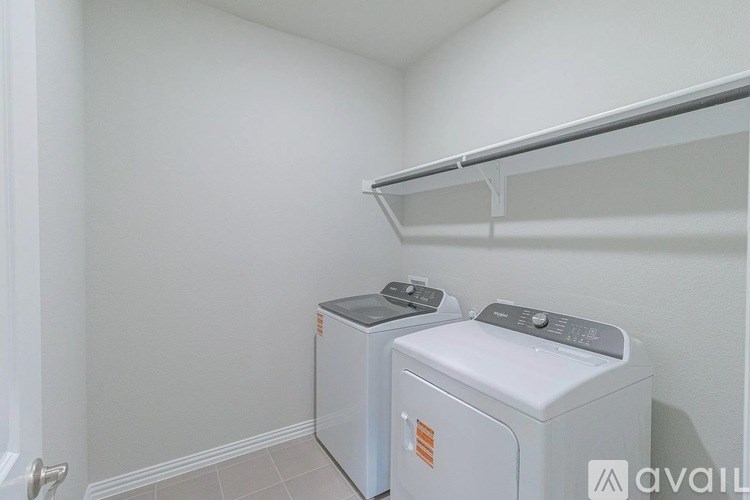 A laundry room with a washer and dryer.