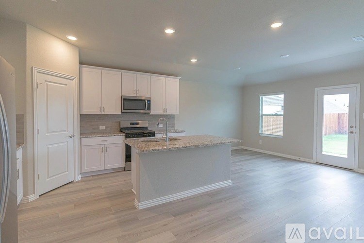 A kitchen with a countertop and cabinets is available for rent.