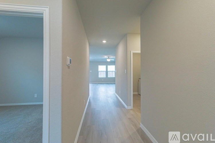 A long hallway with a light at the end.