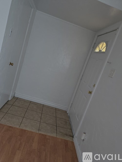 A room with a door and a window.