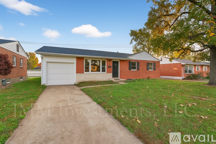 A house with a driveway in front of it.